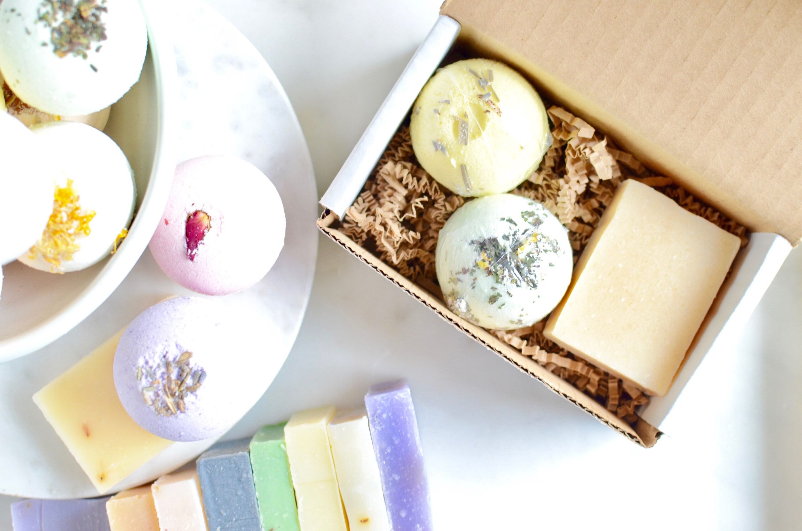 colorful bath bombs and handmade soaps flat lay