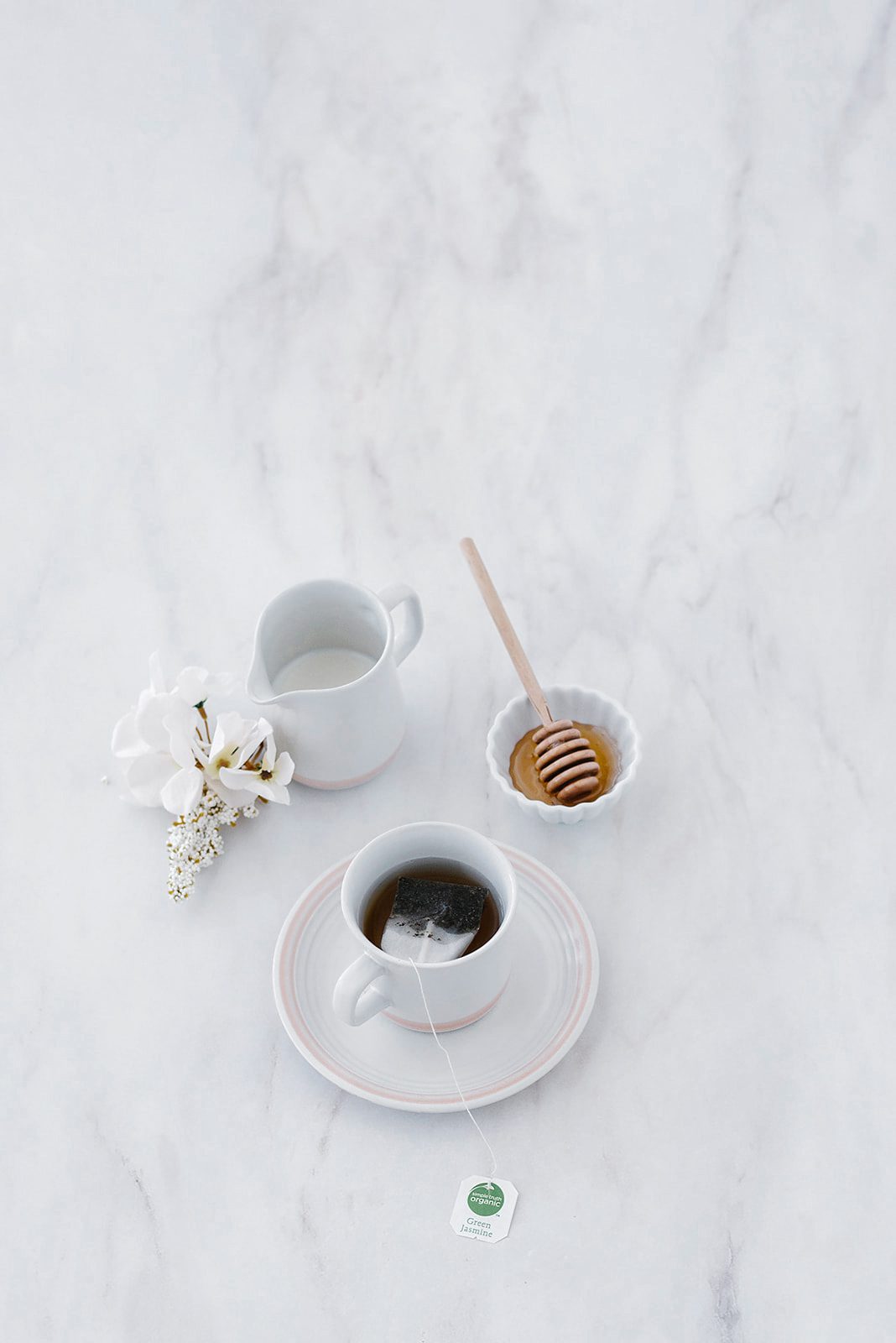 tea cup with honey on marble surface calm morning