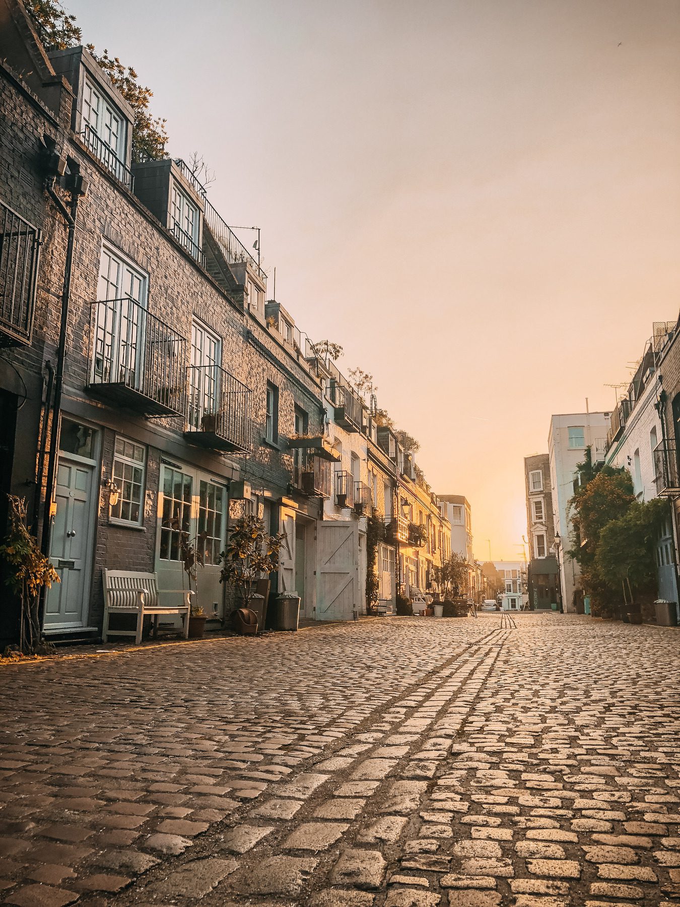 cobblestone street at golden hour walking without phone