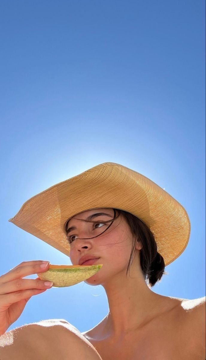woman doing her makeup in soft natural light