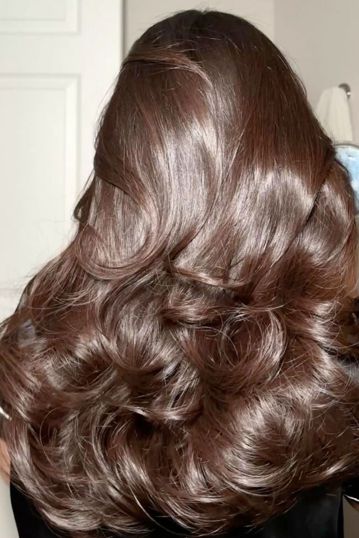 voluminous thick wavy hair from the back