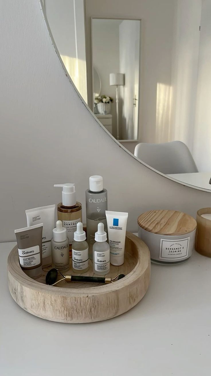 skincare products on bathroom counter with mirror