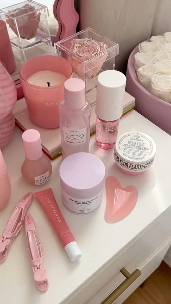 pink skincare flat lay with SPF products