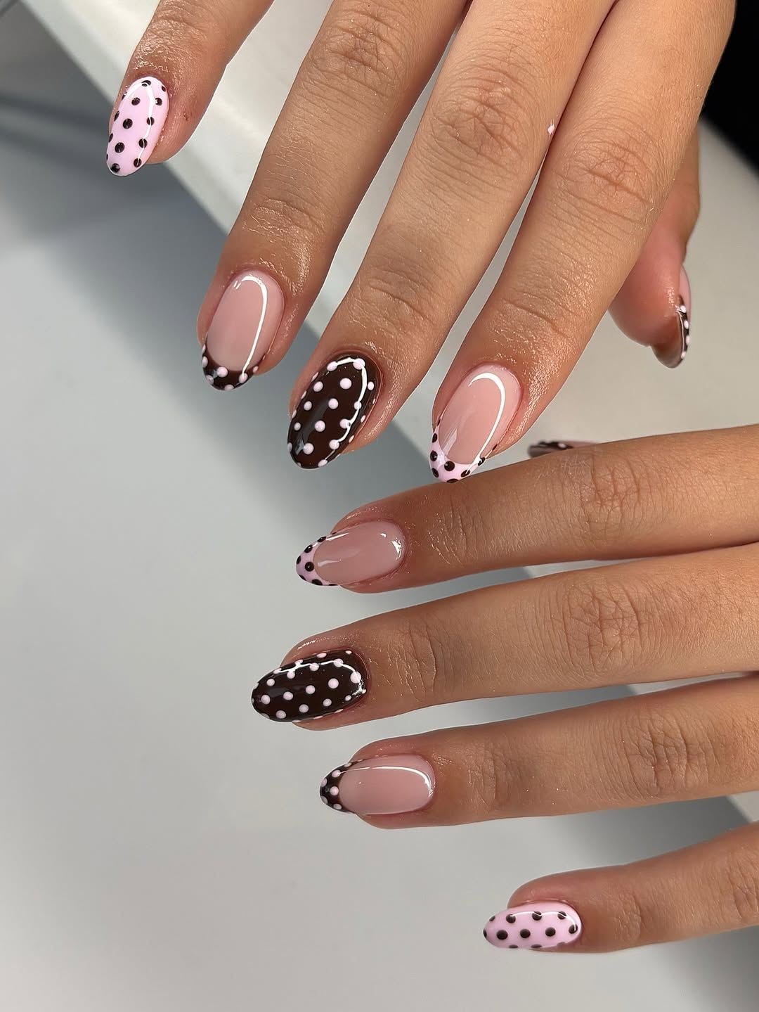 brown and pink polka dot nails with white dots