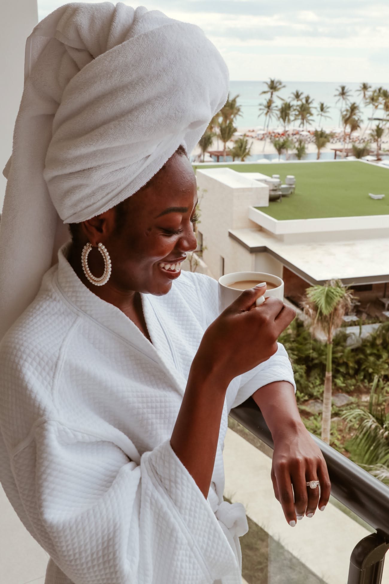 woman in a towel doing her skincare routine